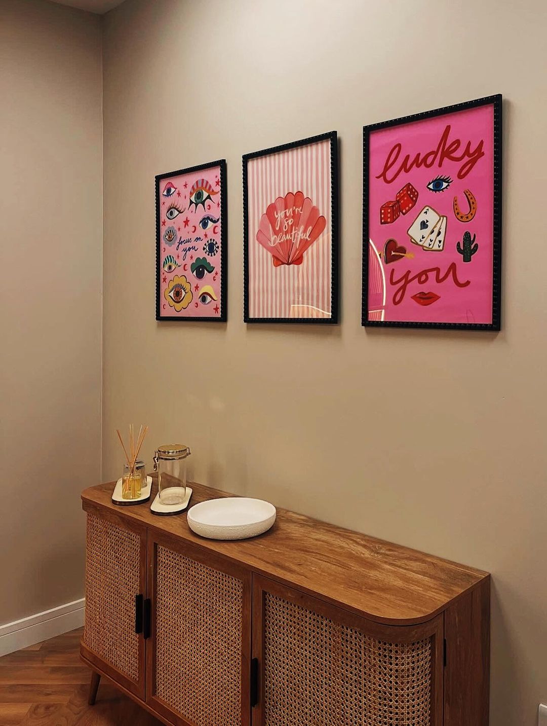 Sideboard and framed prints in the studio